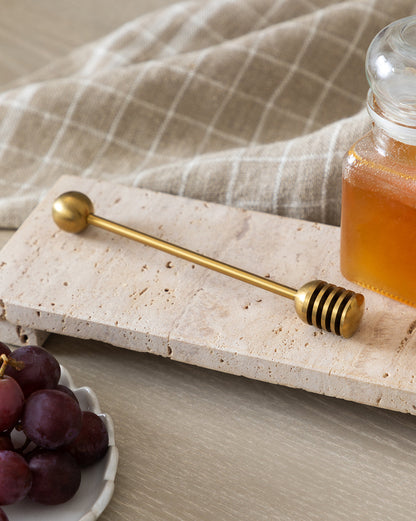 Planche de service sur pied en travertin beige