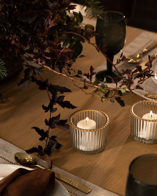 Bougie votive en verre à bord doré